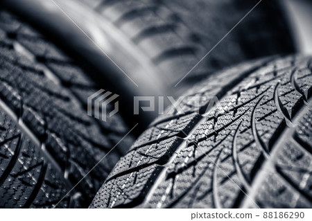 Clean car tires against dark background closeup 88186290