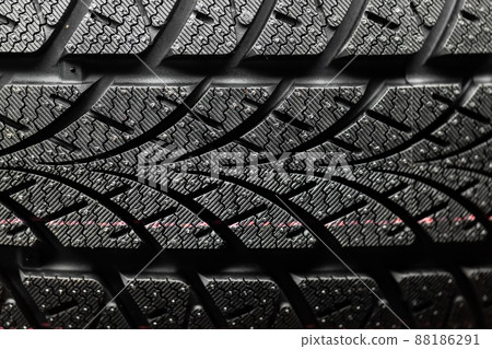 Clean car tires against dark background closeup 88186291