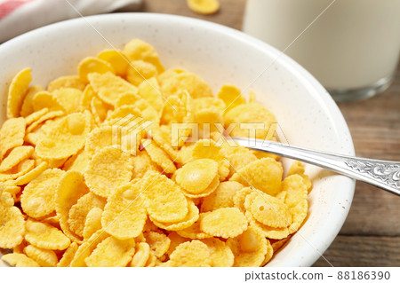 Tasty crispy corn flakes in bowl, closeup Tasty crispy corn flakes in bowl, closeup 88186390