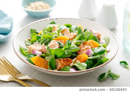 Salmon orange salad with pine nuts, red onion and corn salad. Breakfast. Ketogenic diet 88186945