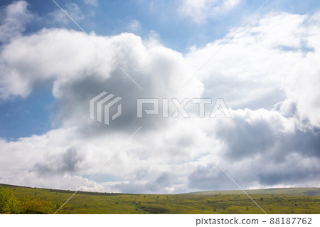 clouds above green hills and meadows. mountain scenery on a sunny day. beautiful summer landscape clouds above green hills and meadows. mountain scenery on a sunny day. beautiful summer landscape 88187762