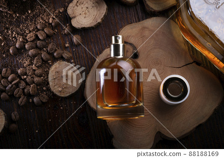 perfume bottles around ingredients on juniper wooden. flat lay. perfumery concept perfume bottles around ingredients on juniper wooden. flat lay. perfumery concept 88188169