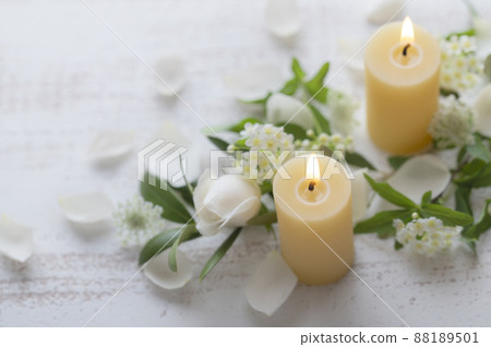 Beeswax candles and flowers Beeswax candles and flowers 88189501