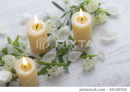 Beeswax candles and flowers Beeswax candles and flowers 88189508