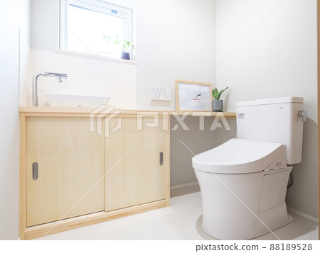 Toilet in a new house with windows 88189528