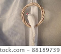 Java sparrow playing with a wreath 88189739