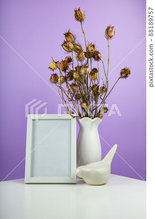 Cozy home desk table with vase with green branch 88189757