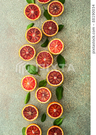 Blood orange halves with spinach leaves 88190034