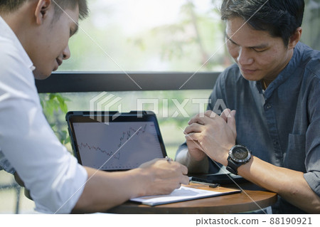 Two businessmen are consulting and planning business operations. 88190921