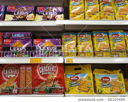 JOHOR, MALAYSIA -JUNE 20, 2021: Variety of biscuits in good and interesting packaging and displayed on the racks inside the shop. Sort by the brand to make it easier for customers to buy. 88193499