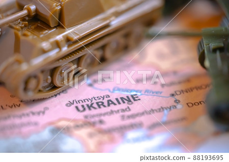 Calgary, Alberta, Canada. Mar 28, 2022. Macro Top view of Scale Model Tanks War Panther Tanks on a Ukraine map. Concept Calgary, Alberta, Canada. Mar 28, 2022. Macro Top view of Scale Model Tanks War Panther Tanks on a Ukraine map. Concept 88193695