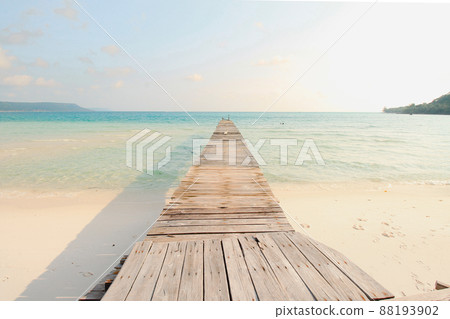 Scenic view of a wooden boardwalk leaving to the white sandy beach of Koh Rong Samloen Island, a popular summer getaway destination in Cambodia Scenic view of a wooden boardwalk leaving to the white sandy beach of Koh Rong Samloen Island, a popular summer getaway destination in Cambodia 88193902