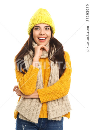 Happy young woman in warm clothes on white background. Winter vacation 88193989