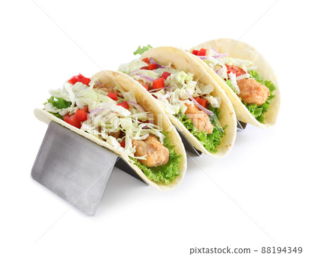Yummy fish tacos in holder isolated on white Yummy fish tacos in holder isolated on white 88194349