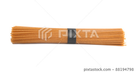 Uncooked buckwheat noodles isolated on white. Japanese cuisine Uncooked buckwheat noodles isolated on white. Japanese cuisine 88194798