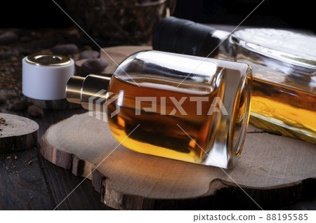 perfume bottles around ingredients  on juniper wooden. flat lay. perfumery concept 88195585