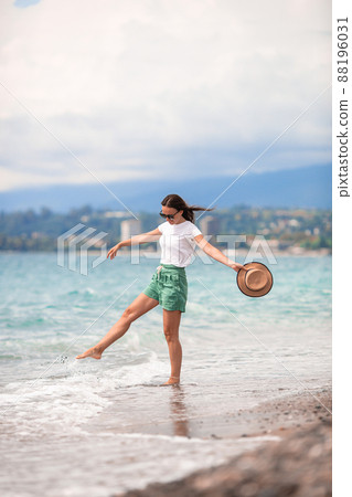 Young beautiful woman relax on the beach Young beautiful woman relax on the beach 88196031