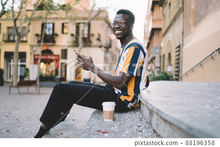 Toothy hipster guy in optical spectacles for vision correction laughing Toothy hipster guy in optical spectacles for vision correction laughing 88196358