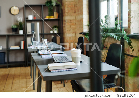 Workplace of contemporary white collar worker in spacious office 88198204