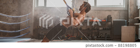 Young man with perfect body training in gym Young man with perfect body training in gym 88198805