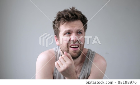Caucasian nervous man looking around having hallucinations. Caucasian nervous man looking around having hallucinations. 88198976