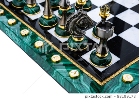 Malachite stone chess pieces on and marble chessboard Malachite stone chess pieces on and marble chessboard 88199178