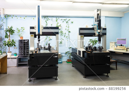 Photo of modern automatic automobile manufacturing workshop. Car production. Industrial scenery Photo of modern automatic automobile manufacturing workshop. Car production. Industrial scenery 88199256