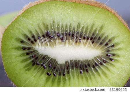sweet and sour halves of green kiwi fruit during cooking sweet and sour halves of green kiwi fruit during cooking 88199665