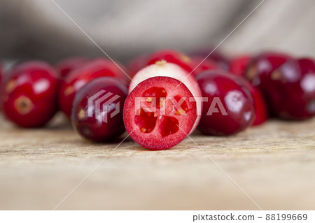 cut into half ripe red berries of garden cranberries 88199669
