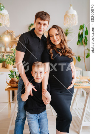 pregnant mom, dad and son. relationships parents and children 88200076