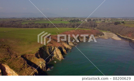 beach between cliffs from drone over Stradbally Cove, Cooper Coast, Waterford, Ireland. 88200629