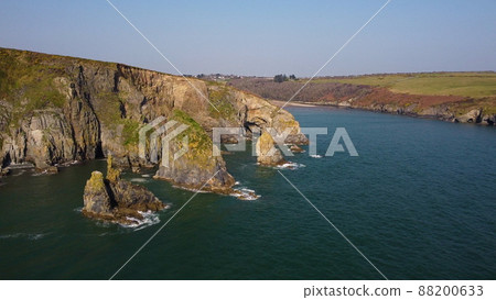 drone over the Atlantic Ocean. flying over cliffs and a blue sea. Stradbally Cove, Cooper Coast, Waterford, Ireland. drone over the Atlantic Ocean. flying over cliffs and a blue sea. Stradbally Cove, Cooper Coast, Waterford, Ireland. 88200633