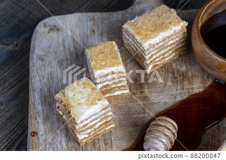 cake made of thin honey cakes and a thin creamy layer cake made of thin honey cakes and a thin creamy layer 88200847