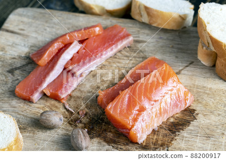 red salted salmon fish meat on a chopping board 88200917