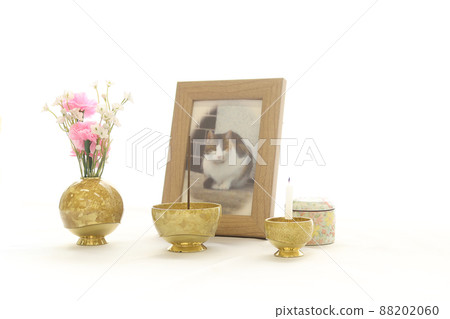Photographs and urns for pet memorial services displayed on the windowsill 3 88202060