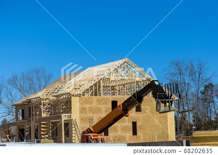 Powerful wheel forklift with telescopic mast at the construction site Powerful wheel forklift with telescopic mast at the construction site 88202635