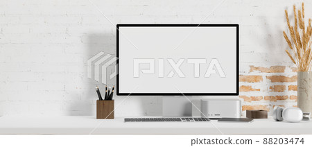 Minimal bright and comfortable workspace with computer on white tabletop 88203474