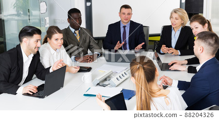business partners discussing projects and ideas at meeting 88204326