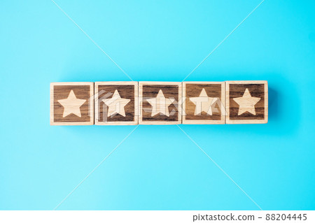 star symbol block on blue background. Service rating, ranking, customer review, satisfaction, evaluation and feedback concept star symbol block on blue background. Service rating, ranking, customer review, satisfaction, evaluation and feedback concept 88204445
