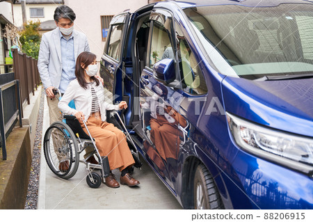 Women and men on wheelchairs Women and men on wheelchairs 88206915
