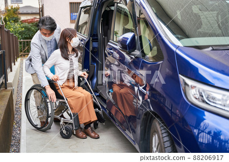 Women and men on wheelchairs Women and men on wheelchairs 88206917