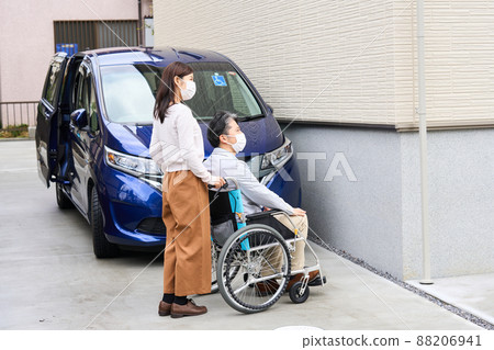 Men and women on wheelchairs Men and women on wheelchairs 88206941
