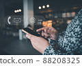 Contact Us Support Service and Information Connect Concept, Female's Hands is Using Mobile Phone and Laptop for Corporate Information Contact Via Email Support. Customer Communication Contact Services 88208325