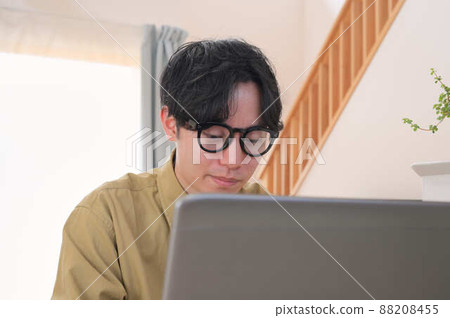 Men working on PC at home Work at home Men working on PC at home Work at home 88208455