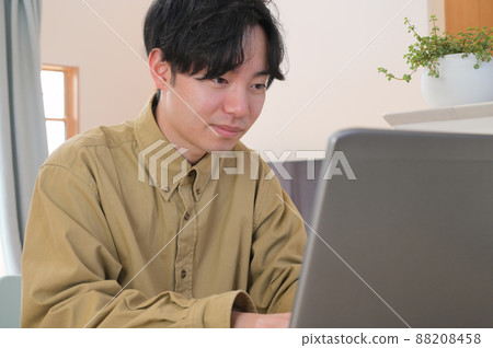Men working on PC at home Work at home Men working on PC at home Work at home 88208458