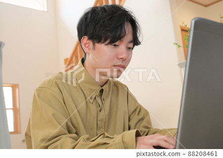 Men working on PC at home Work at home Men working on PC at home Work at home 88208461