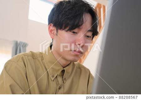 Men working on PC at home Work at home Men working on PC at home Work at home 88208567
