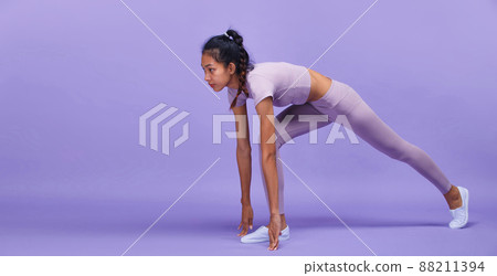 Full length of Asian slim tanned skin Fitness woman hands touch ground floor ready to start to run Full length of Asian slim tanned skin Fitness woman hands touch ground floor ready to start to run 88211394