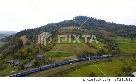 The train goes in the mountains. Ukraine The train goes in the mountains. Ukraine 88211612