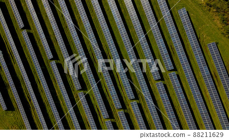 Drone shot of solar panel rows at a solar power facility Drone shot of solar panel rows at a solar power facility 88211629